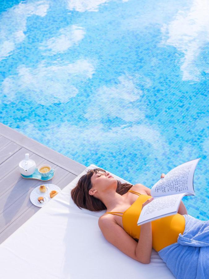 The View Bouznika Hotel Exterior photo A woman sunbathing