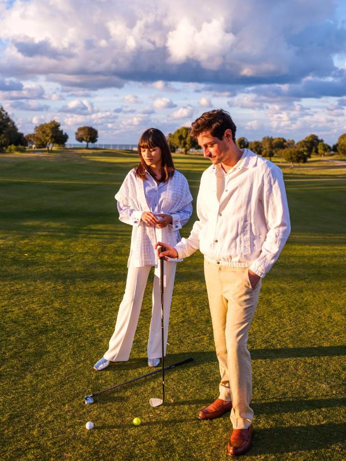 The View Bouznika Hotel Exterior photo Golfers wearing white
