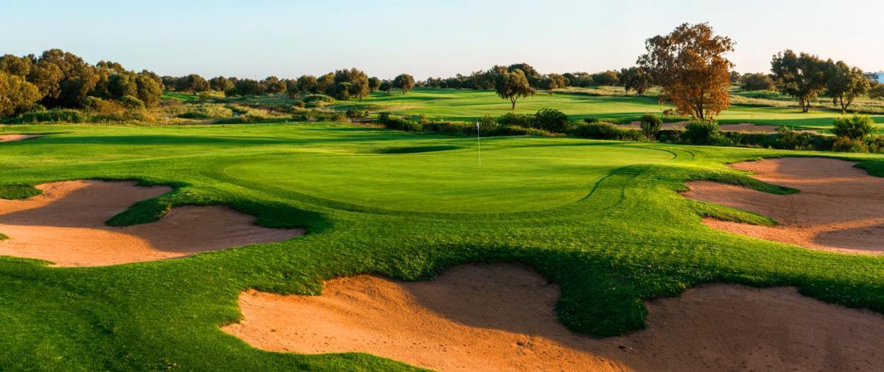 The View Bouznika Hotel Exterior photo Golf course at the resort